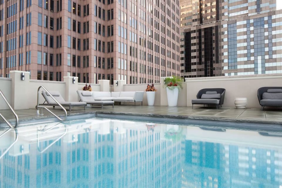 Stretch out on plush loungers beside the sparkling rooftop pool.