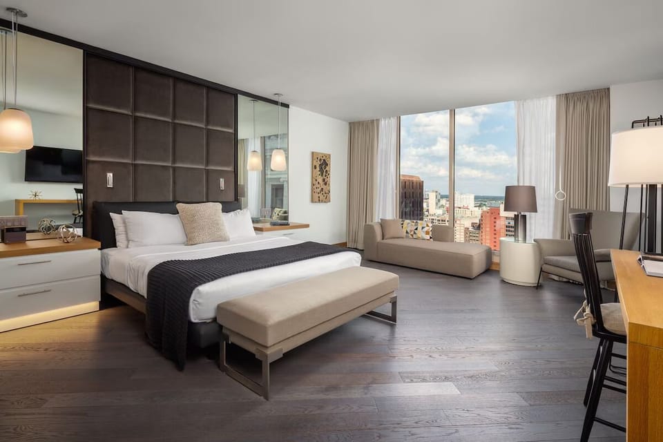 Stretch out in a sunlit suite with panoramic city views.