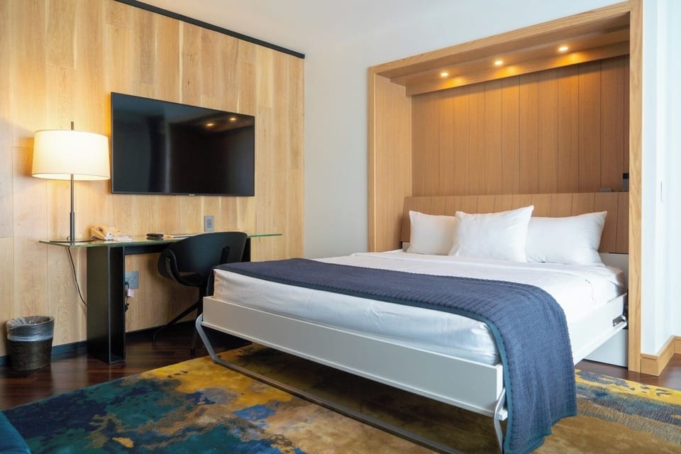 Unwind in a sleek nook bed with warm lighting.
