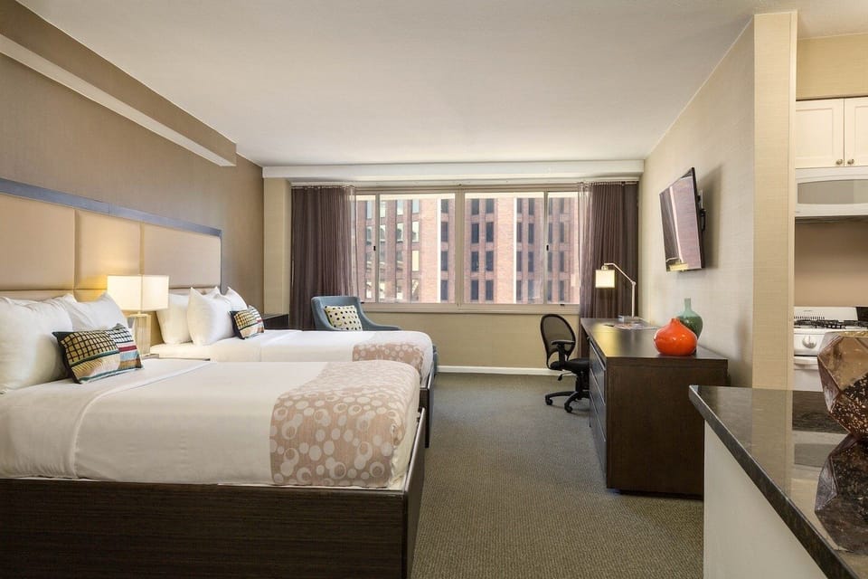 Stretch out comfortably with two beds and a spacious work area.