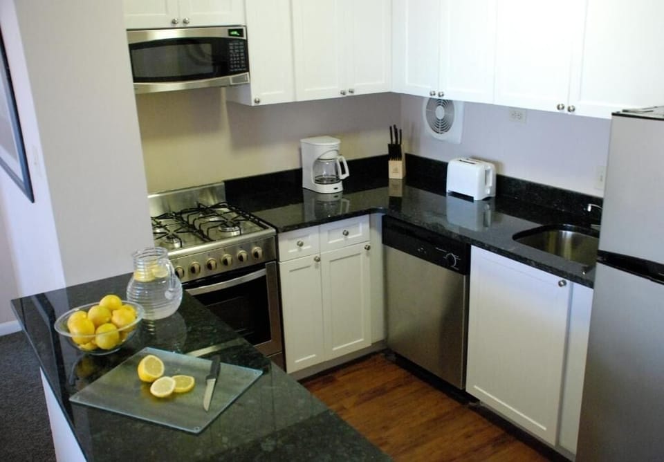 Cook with ease in a fully equipped kitchen with sleek counters.