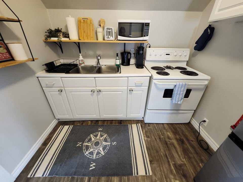 You will find dishes, utensils, some cooking staples, and a mini fridge