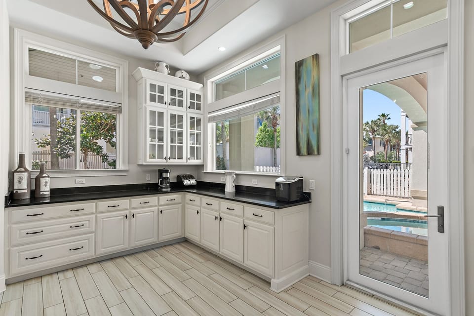 GOURMET, FULLY-STOCKED KITCHEN: Cook in style with upscale appliances, custom cabinetry, and Pool and Hot Tub Views!
