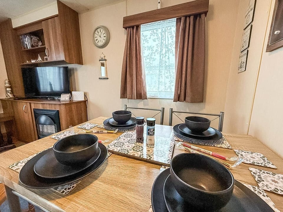 The open kitchen area connects seamlessly to the dining area, making it ideal for entertaining.