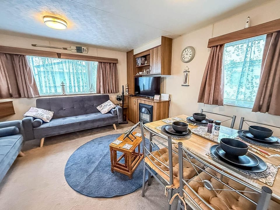 The open kitchen area connects seamlessly to the dining area, making it ideal for entertaining.
