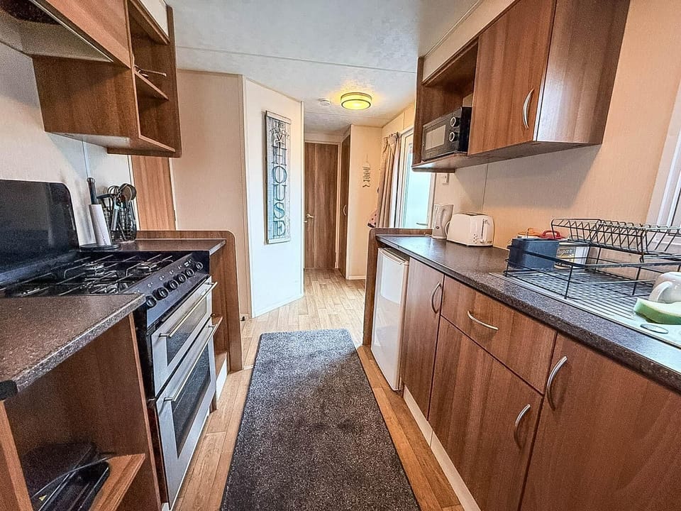 The open kitchen area connects seamlessly to the dining area, making it ideal for entertaining.