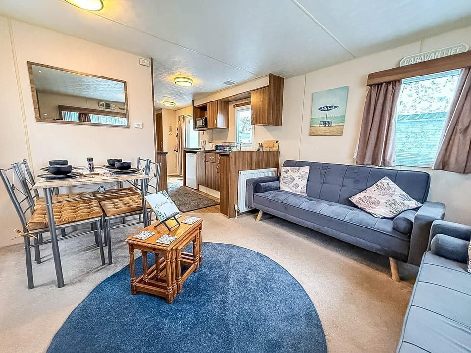 The holiday home living room is a welcoming space to relax and recharge after a busy day.