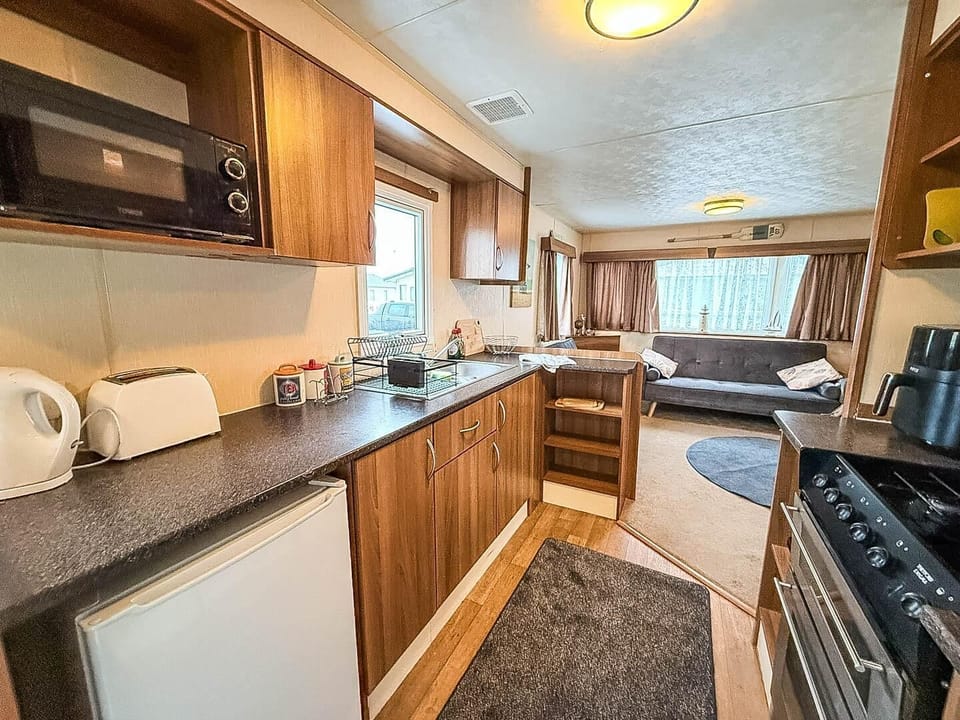 The open kitchen area connects seamlessly to the dining area, making it ideal for entertaining.