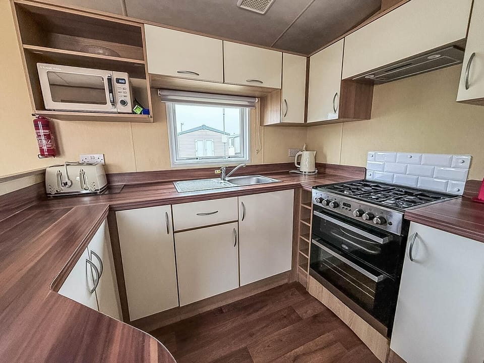 Enjoy modern convenience in a kitchen tailored for effortless UK holidays and memorable family holidays.