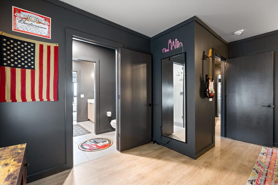 Bedroom with Closet, Mirror, and Shared Bath