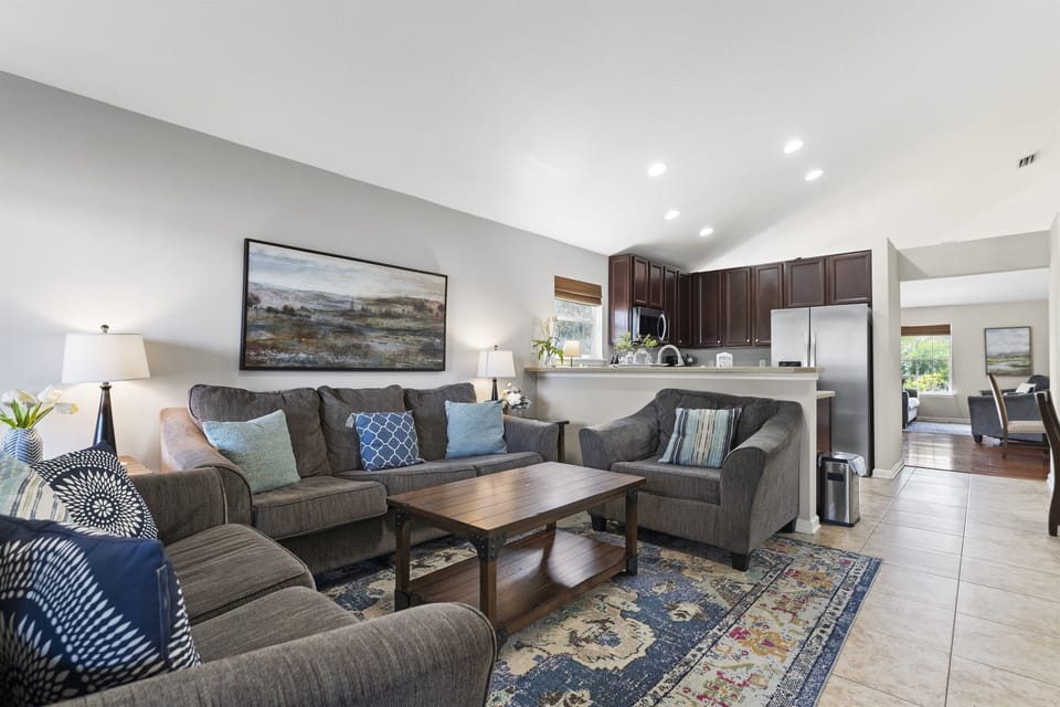 Spacious family room designed for comfort with open layout and modern furnishings