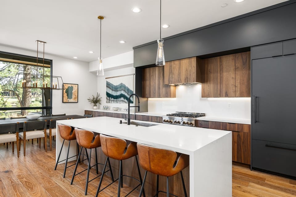 A chef's delight! The gourmet kitchen features sleek countertops, state-of-the-art appliances, and an island perfect for meal prep or casual dining.