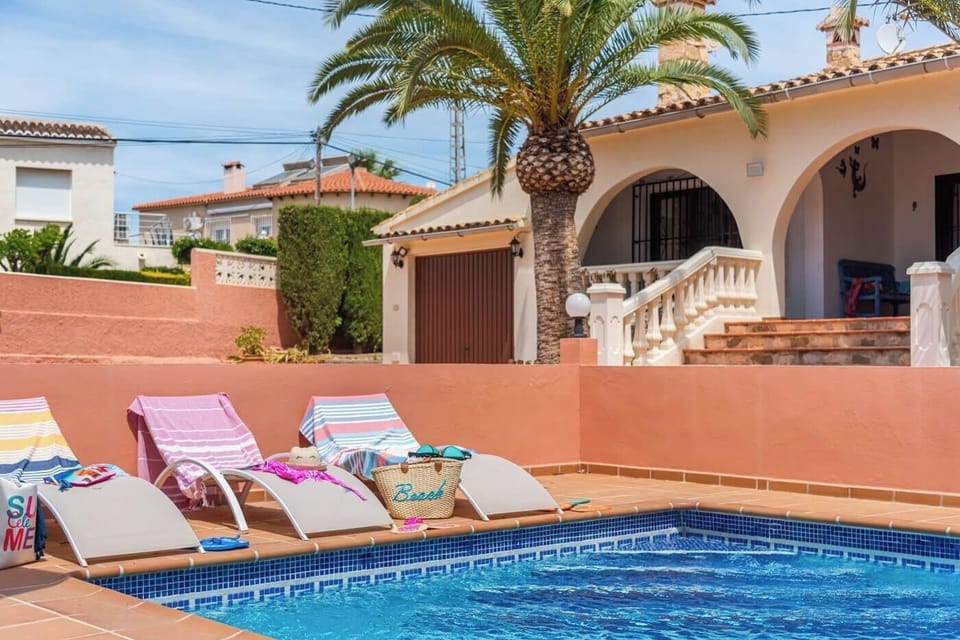 Beautiful holiday villa with private pool situated in Calpe (Costa Blanca) for 6 people, with three bedrooms and two bathrooms distributed on one floor.INTERIOR: The villa is distributed on one floor which is accessed by external stairs. The villa has a pleasant living-dining room with TNT-satellite TV (English) and air conditioning, a separate kitchen with gas cooker, dishwasher and washing machine. This villa for 6 has 3 double bedrooms : 2 bedrooms each with 1 double bed of which 1 with A/C and the third with a bunk bed, 1 bathroom with bathtub and 1 bathroom with shower.OUTSIDE: The villa has a large plot with a nice terrace partly covered, a private fenced rectangular swimming pool of 8x4 m with Roman steps and portable barbecue. Ample private parking for 2 vehicles on the same plot. The plot is completely fenced.LOCATION: This villa is located in a quiet residential area close to amenities and the beach. It is only 400 m from the nearest supermarket and 1,1 km from the sandy beach Playa del Arenal of Calpe with its shops and restaurants. The centre of Calpe is only 1,8 km away.REMARKS: Free WiFi internet access. Pets up to 12 kg are allowed with supplement.