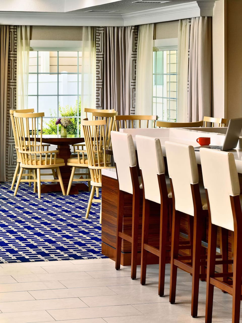 Settle in for breakfast and work with bright window views.