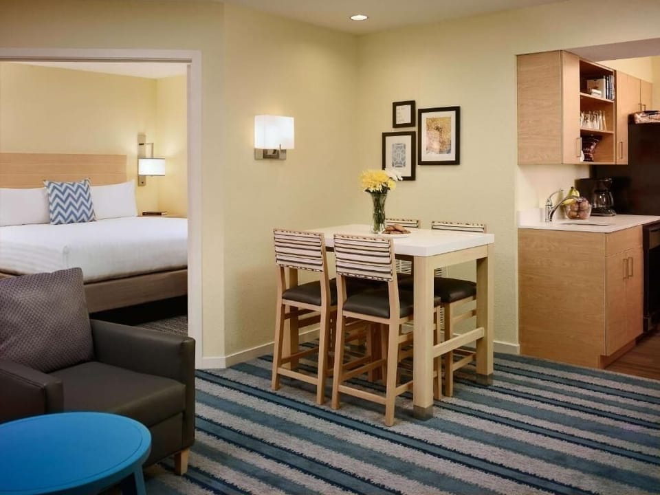 Unwind in a bright suite with cozy bedroom just beyond.