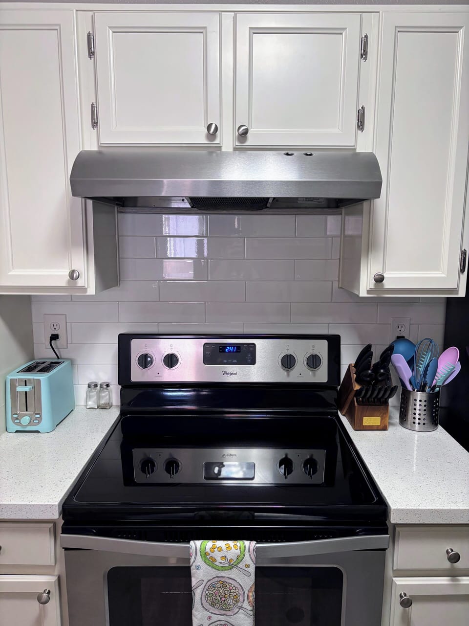Full kitchen with glass cooktop stove and oven