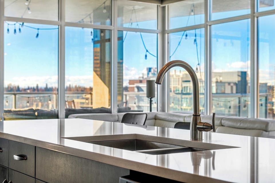 A stylish kitchen island featuring a deep, modern sink, perfect for meal prep and cleaning with ease.