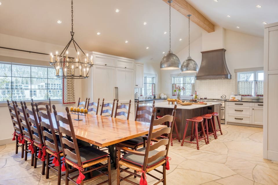 Large, open kitchen with plenty of seating at the tables and island.