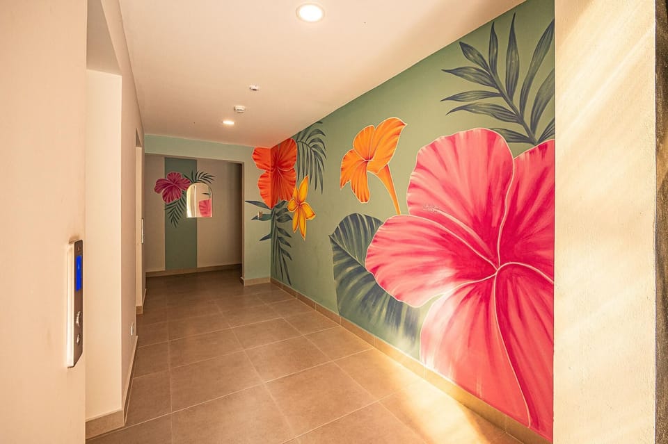 Elevator hallway with hand-painted murals