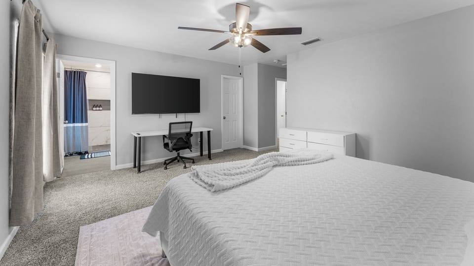 🌙✨ Sleep tight in our cozy bedroom featuring a comfy bed and a refreshing ceiling fan and TV! 🛏️💤 Perfect for sweet dreams and relaxing stays. 