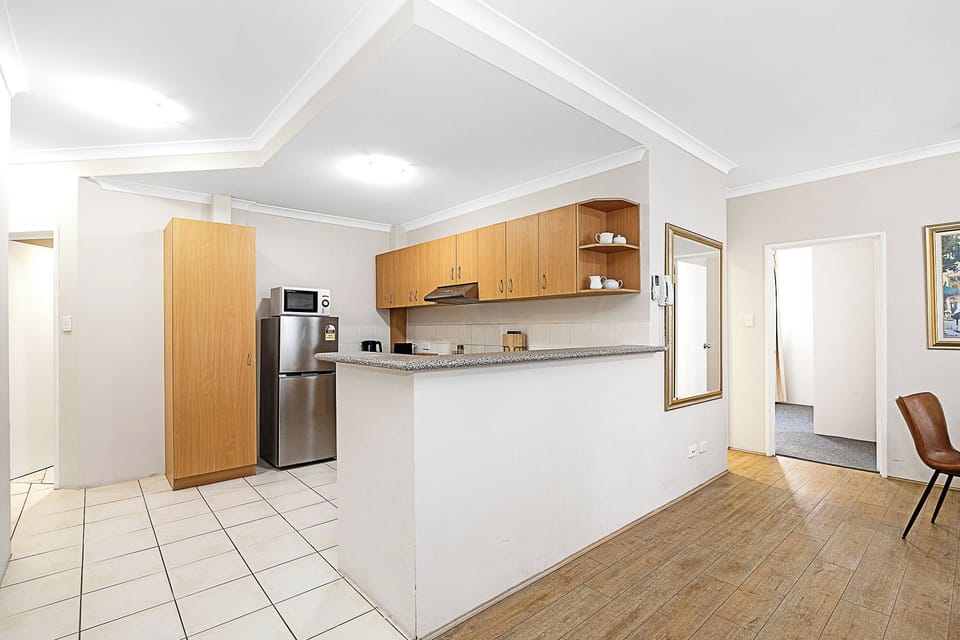 Enjoy a spacious open-plan kitchen and living area, perfect for modern living and entertaining.