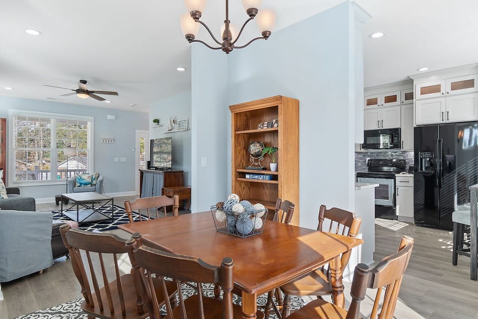 Relax in your open-concept living space where dining flows into kitchen and cozy seating areas, perfect for memorable meals together.