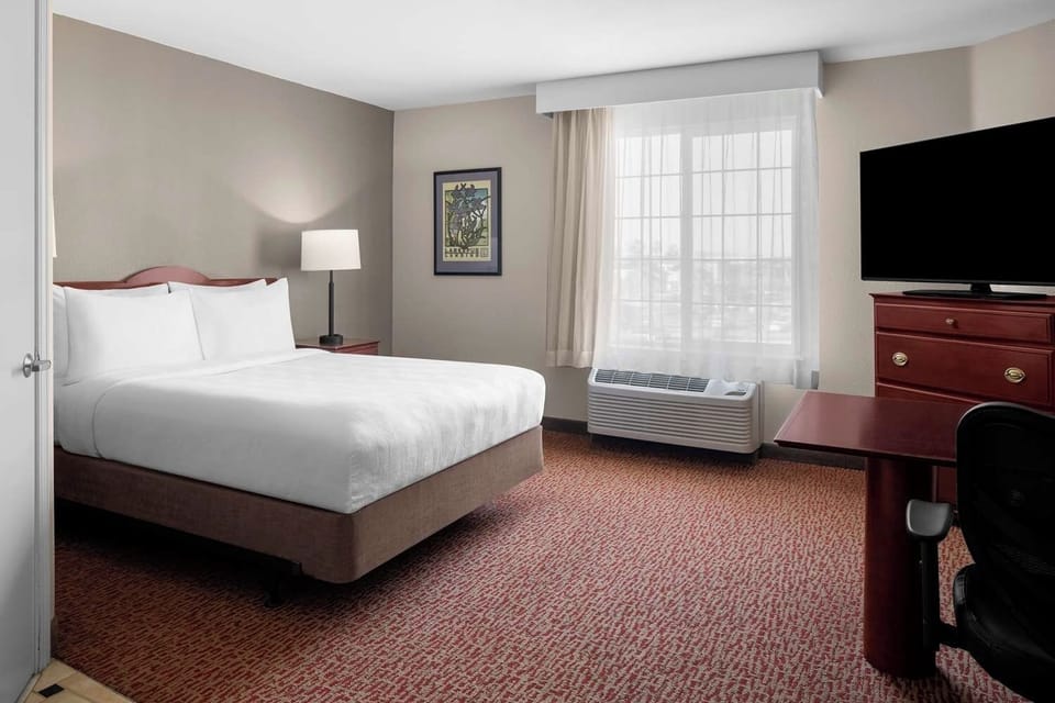 Unwind in a bright king bedroom with HDTV comfort.