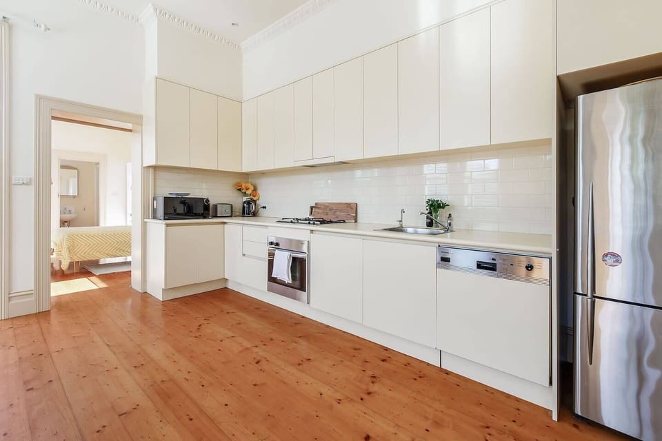Start your morning with a fresh brew from the Nespresso machine in the well-equipped kitchen, featuring an oven and dishwasher. 