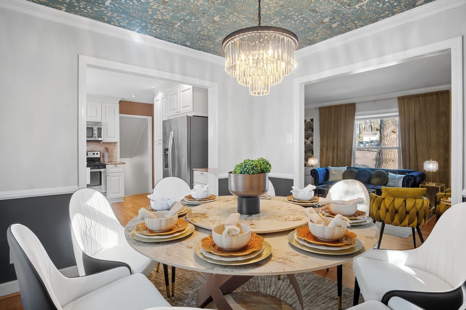 Experience dining under the glow of an elegant chandelier 
