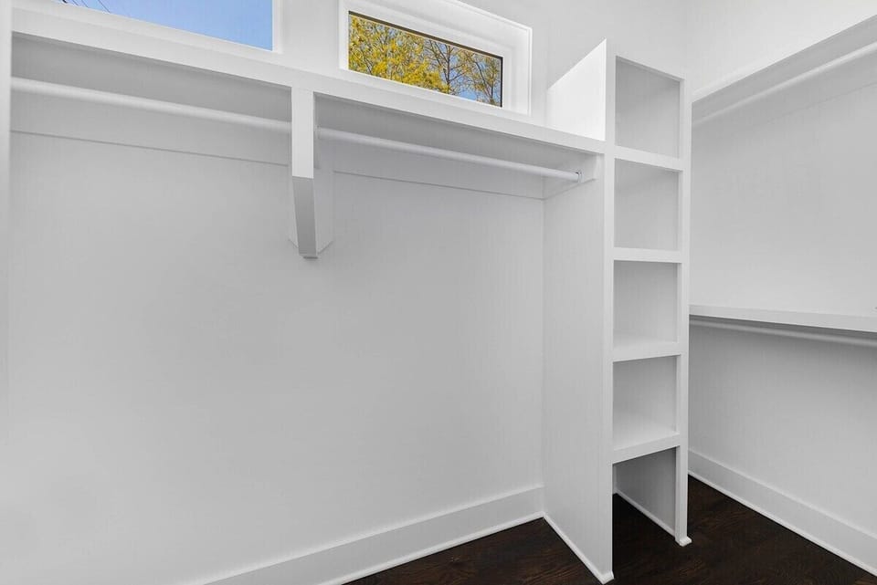 Primary bedroom walk-in closet