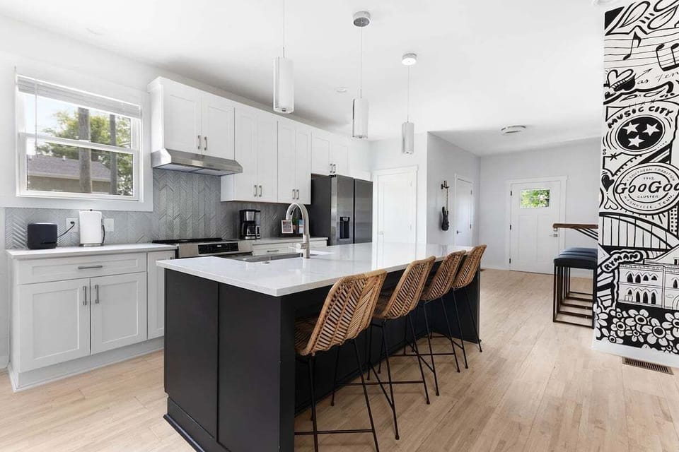 Sleek, modern kitchen with oversized island seating for five and premium finishes.