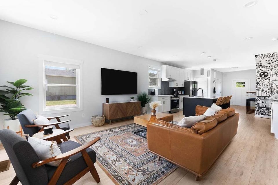 Open concept space with designer furniture and curated touches throughout.