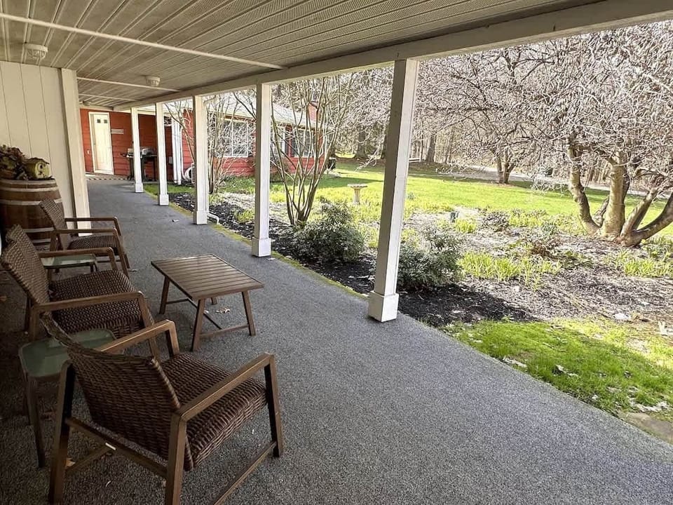 Covered Front Porch - Separate Game Cabin rental in the background.