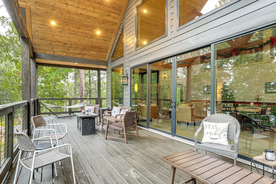 Covered Deck | Outdoor Seating & Lounge Areas | Peek-A-Boo Lake Views
