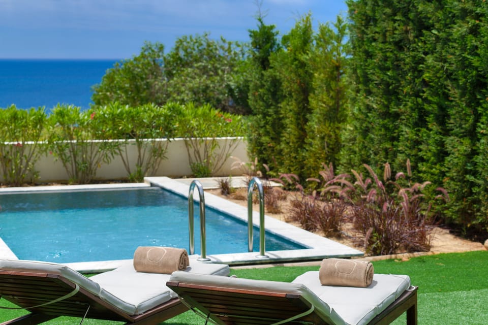 Pool area with sun loungers for relaxation