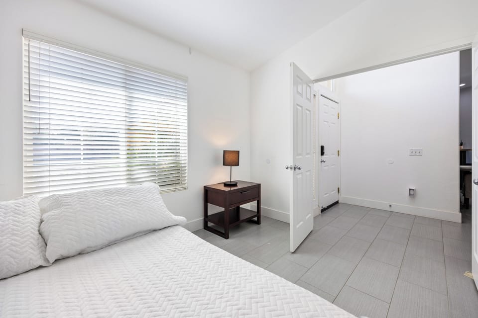 Bright bedroom near the front entry, perfect for quick access and a smooth arrival.
