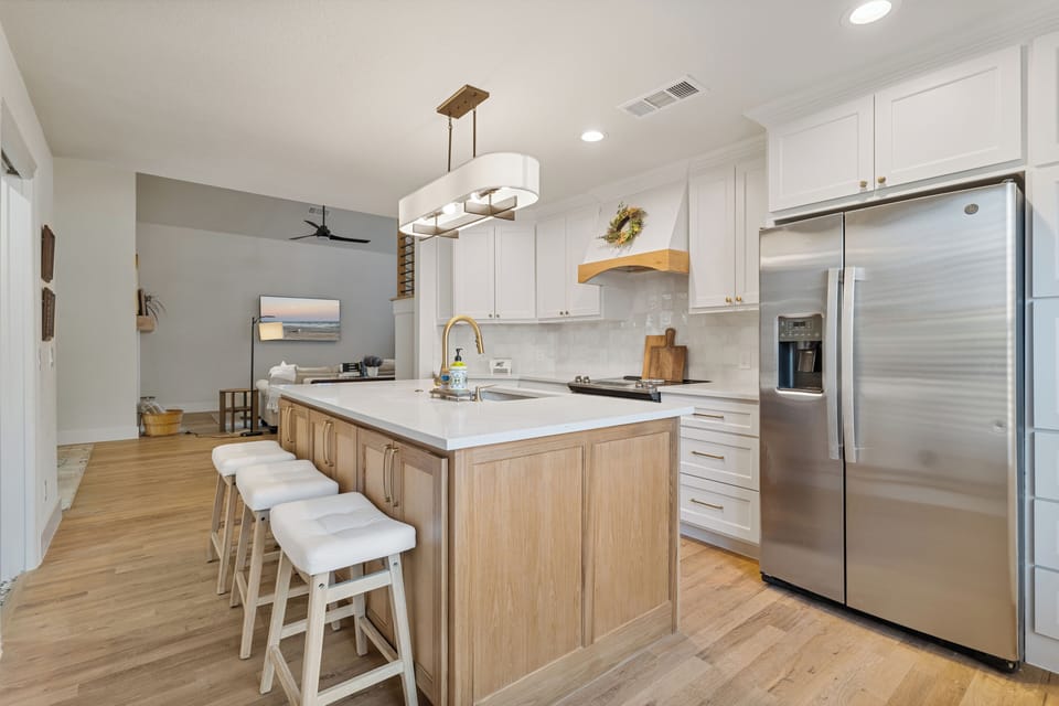 Kitchen view island with refrigerator 