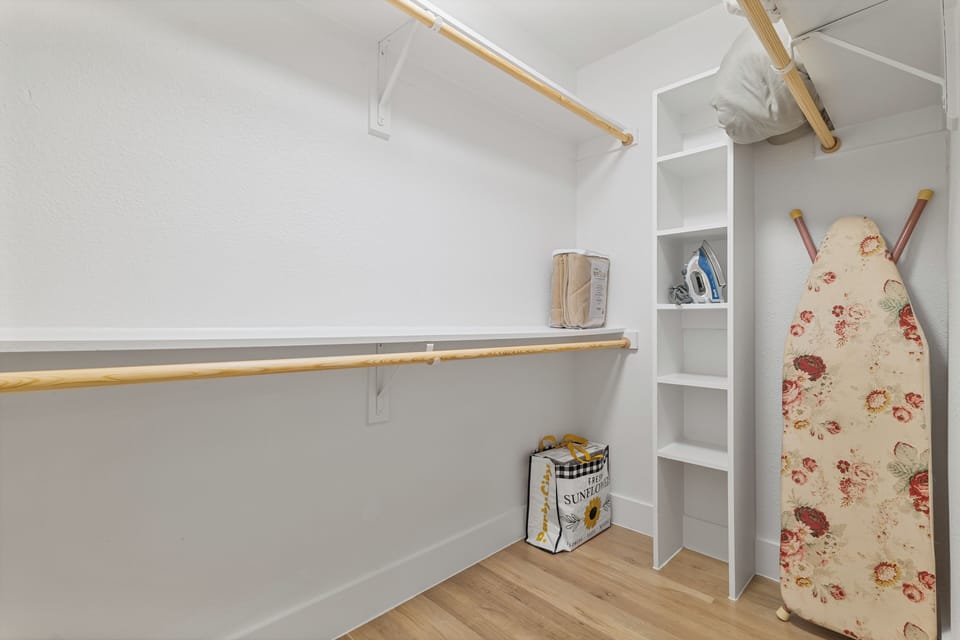 Master walk-in closet for storage with iron and iron board