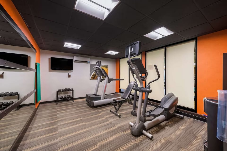Recharge your energy with a quick workout in the bright gym.