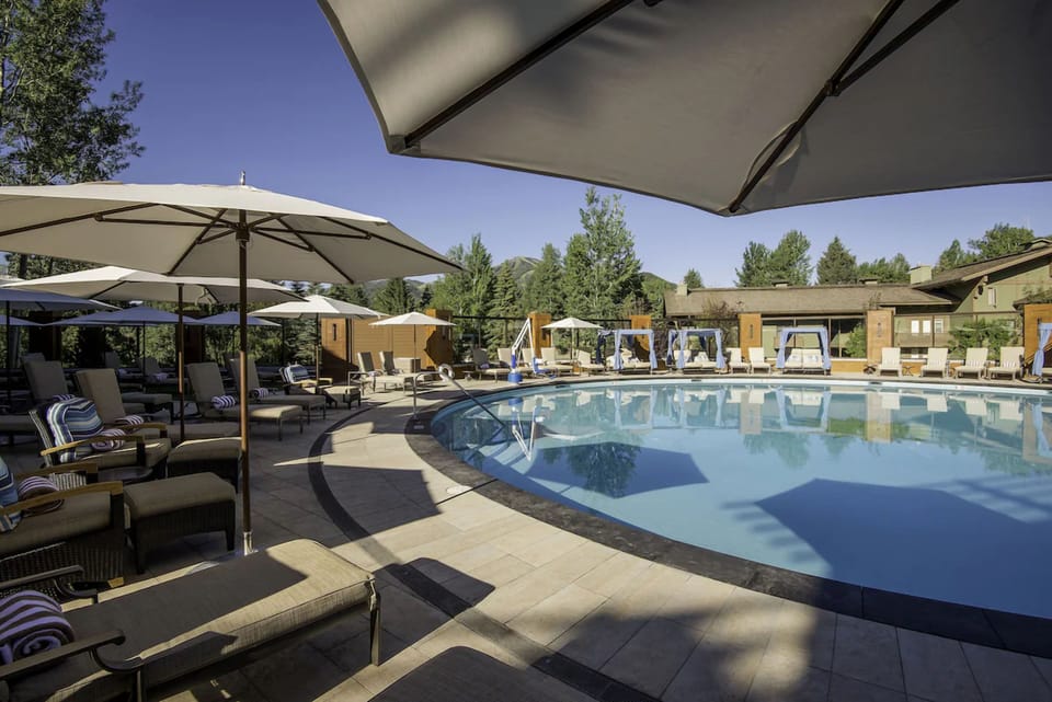 Float through a serene pool loop lined with cushioned loungers.