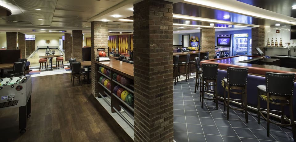 Gather at the bar, then roll into an evening of games.