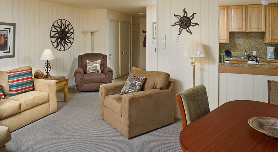 Enjoy open-plan comfort with lounge seating and casual dining nearby.
