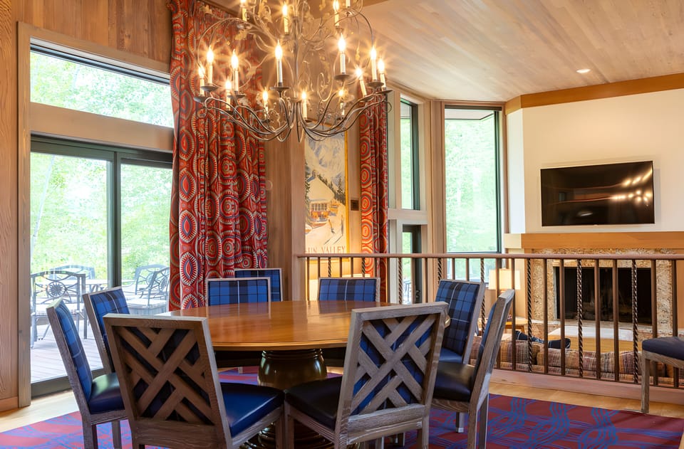 Savor long dinners beneath the chandelier, steps from the patio.