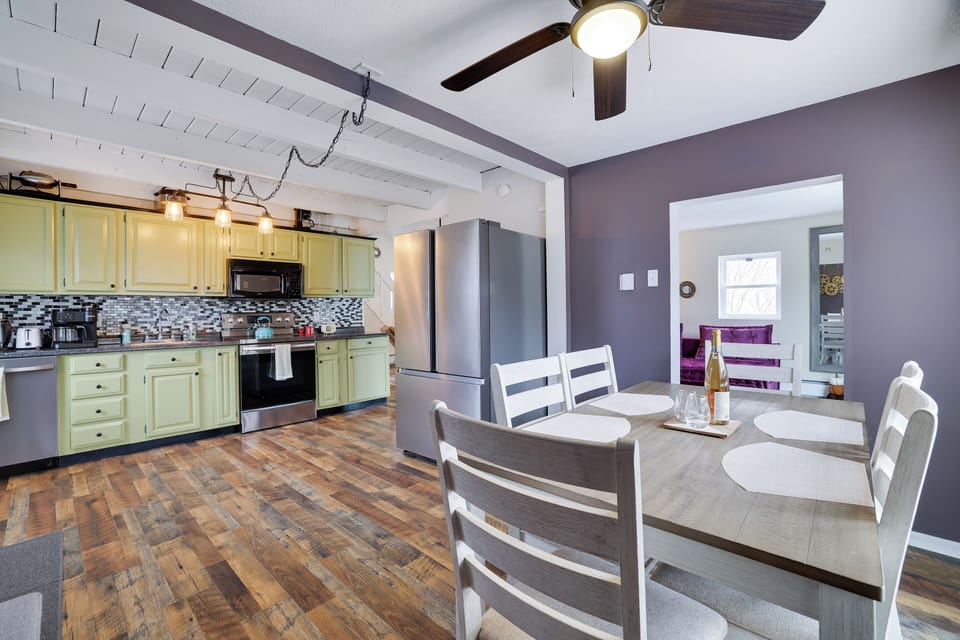 Spacious kitchen with modern appliances, rustic charm, and a cozy dining area—perfect for home-cooked meals and gatherings.