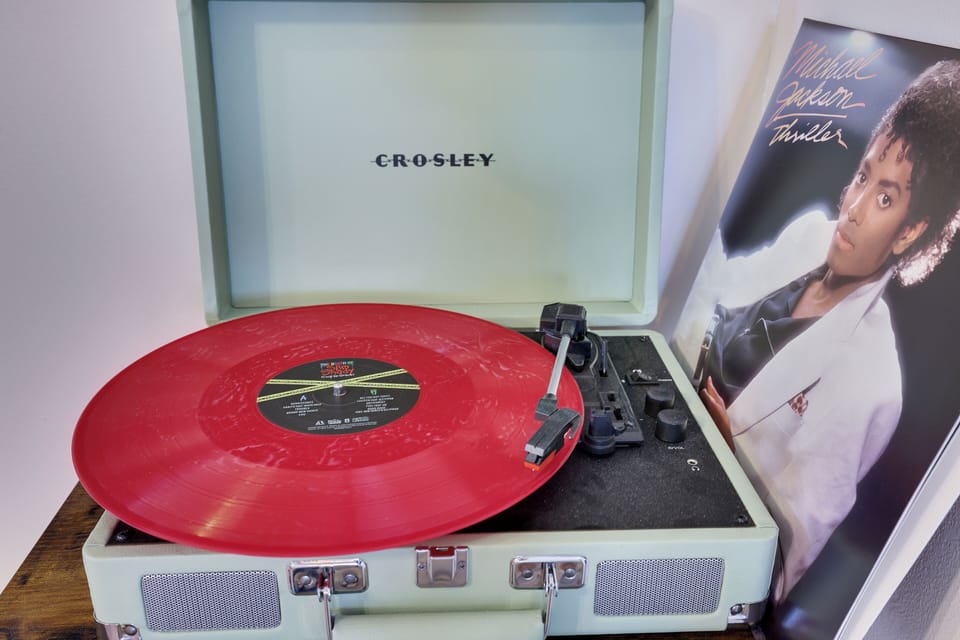 Vintage Crosley record player with classic vinyl—perfect for music lovers and a nostalgic touch.