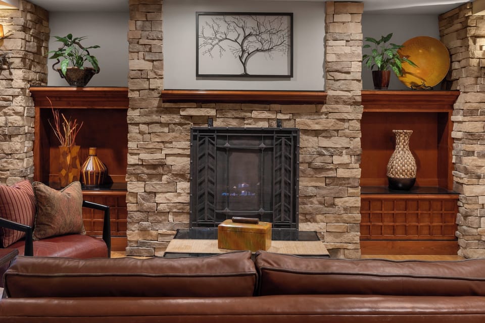Unwind by the glowing fireplace in this cozy lounge.