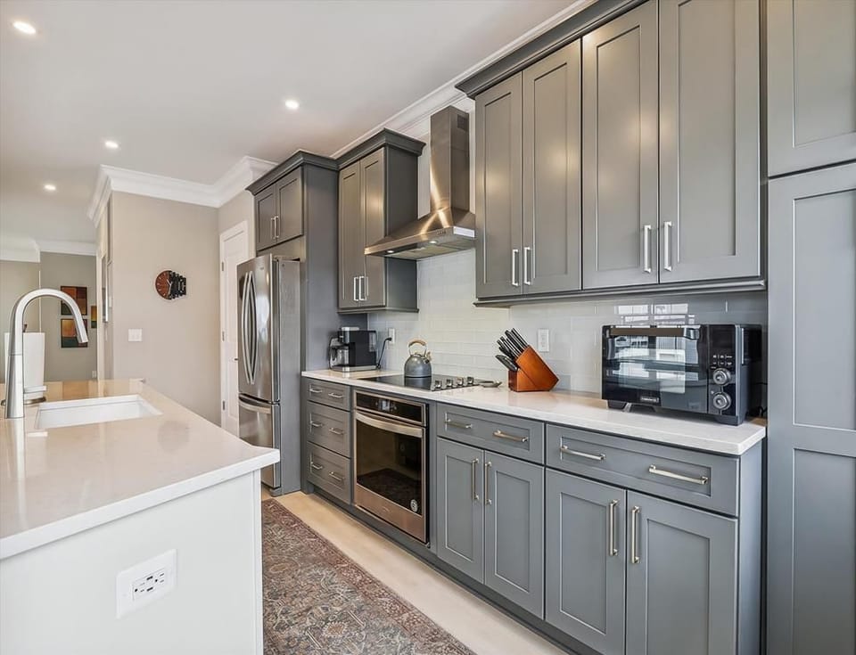 Sleek and well-equipped kitchen with plenty of counter space and high-end cabinetry.