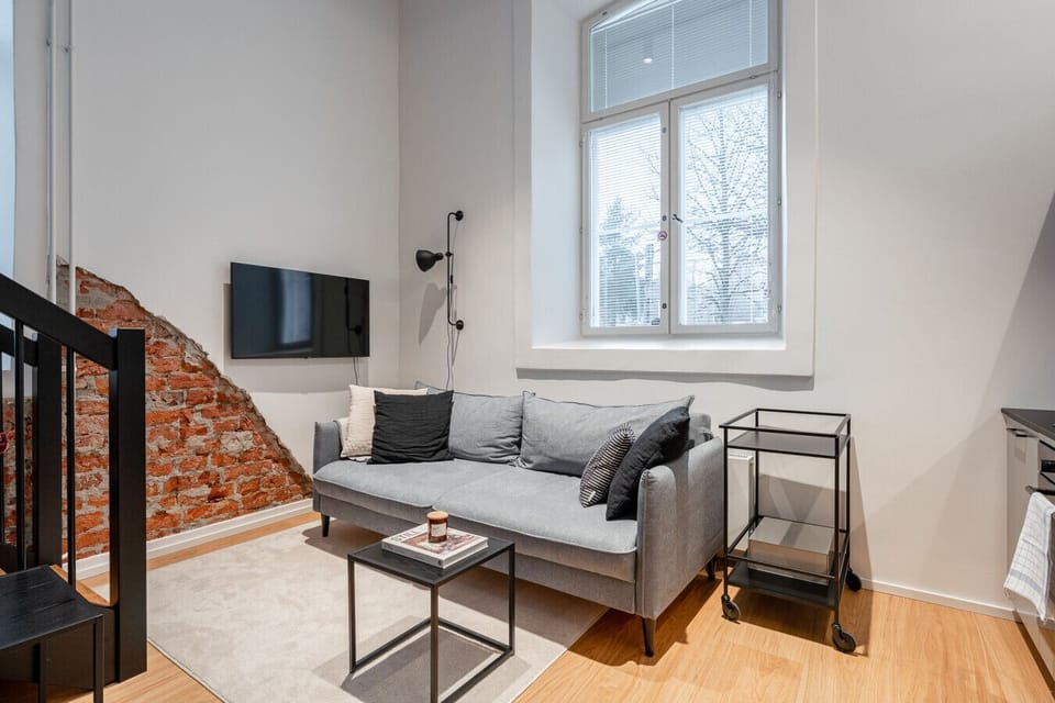 Kick back on the comfortable sofa and stream your favorite shows on the flat-screen TV after a day of exploring the city. Large windows let in plenty of natural light, making this a perfect, relaxing spot for your morning coffee.