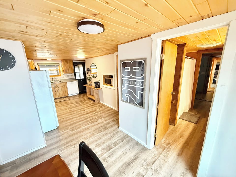 Entrance to the full bathroom from the kitchen/dining room space. 