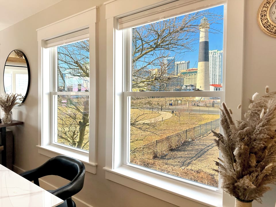 The dining room windows frame incredible views of the lighthouse and cityscape. 